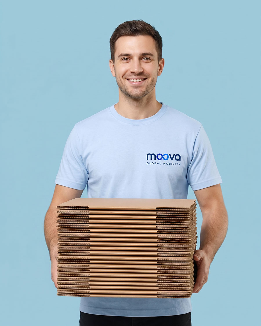Smiling MOOVA crew member holding flat moving boxes